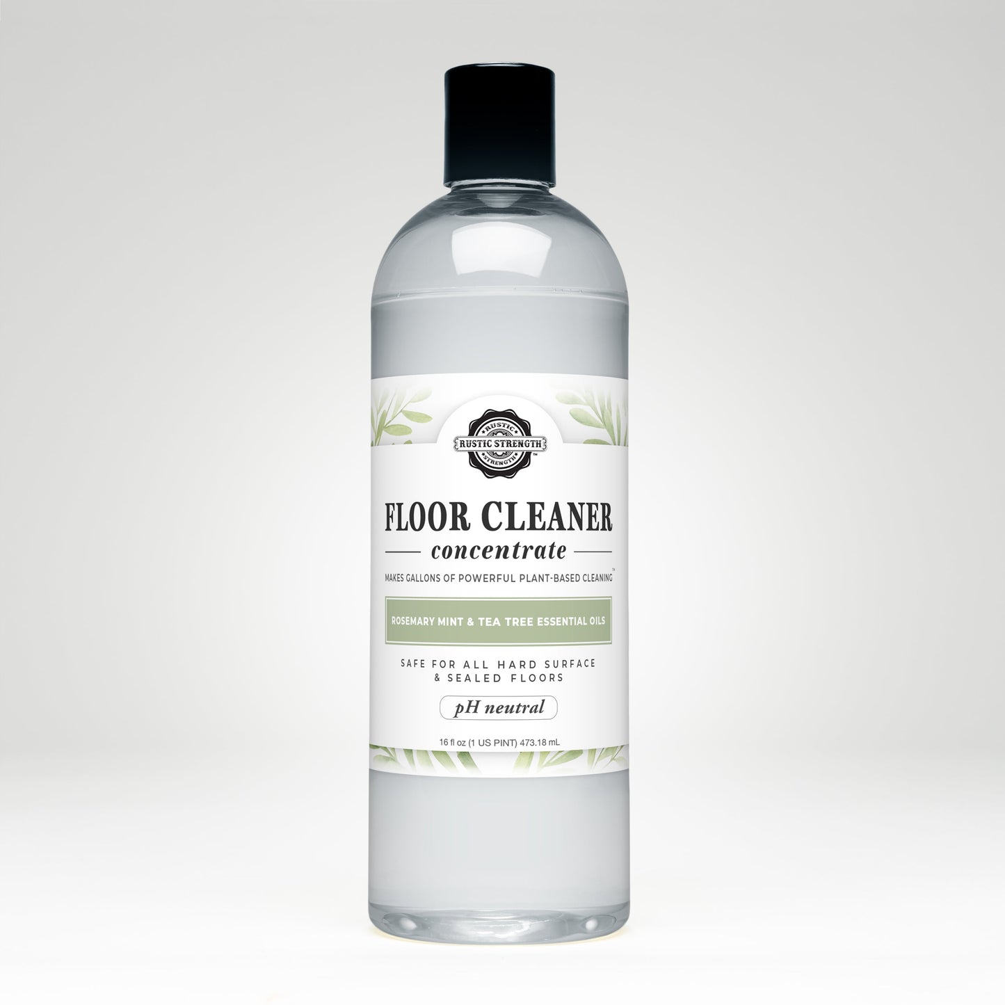 A 16.5 fl oz clear plastic bottle of Rustic Strength Floor Cleaner Concentrate | Rosemary, Mint & Tea Tree, with a black cap and a white label featuring green leaf accents and product details.