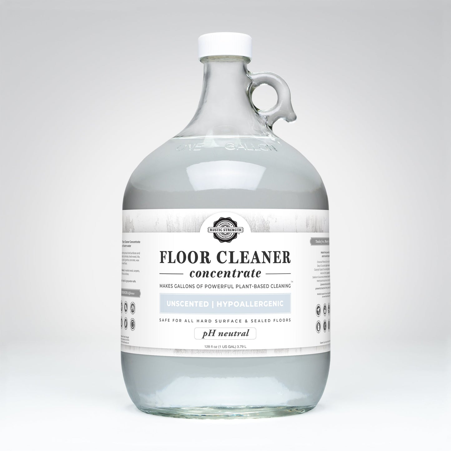 A clear gallon jug of Rustic Strength Floor Cleaner Concentrate | Unscented—hypoallergenic, pH neutral, non-toxic, and safe for all hard surfaces and sealed floors. The bottle includes a handle and white cap.