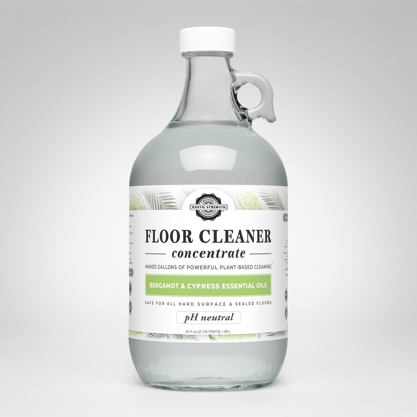 Rustic Strength Floor Cleaner Concentrate | Bergamot & Cypress: clear glass bottle with white cap and handle. Biodegradable, plant-based cleaner with bergamot & cypress oils; pH neutral and safe for hard surfaces and sealed floors.