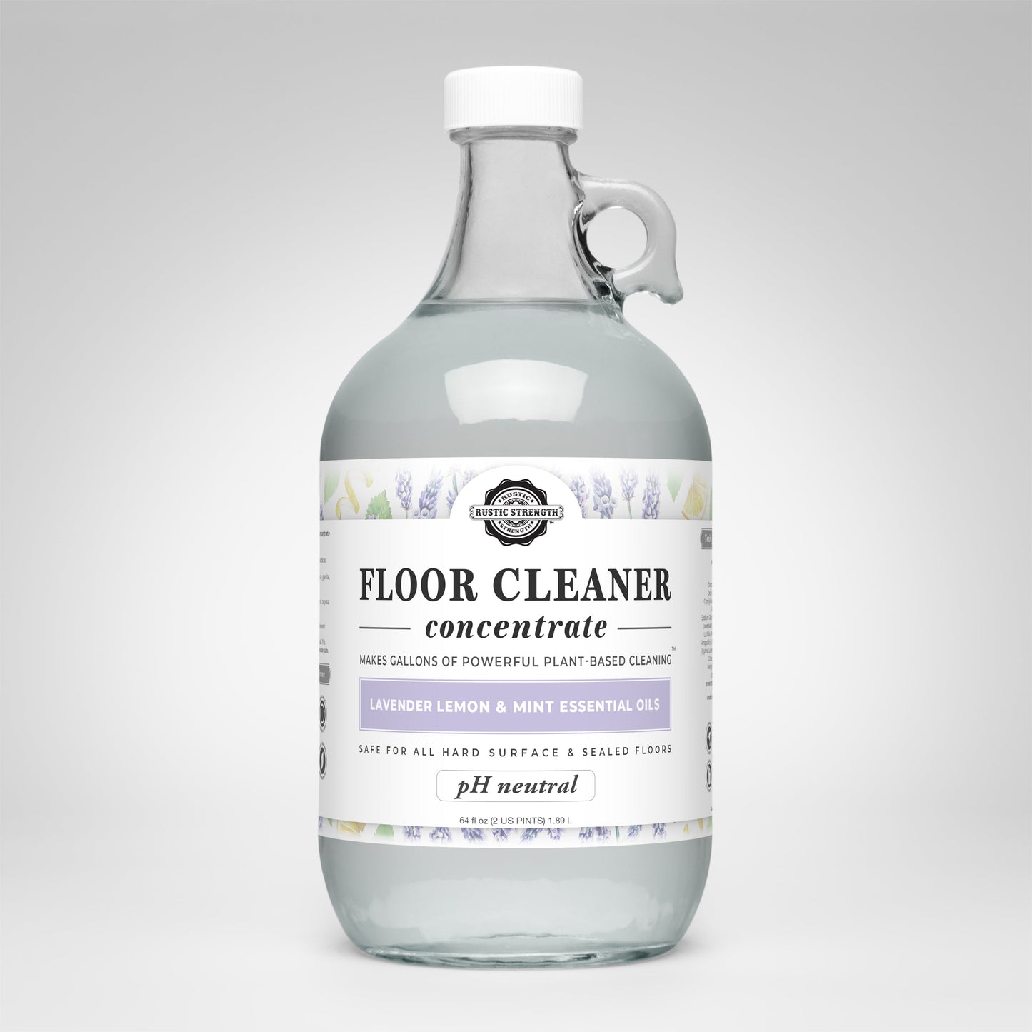 Rustic Strength Floor Cleaner Concentrate | Lavender, Lemon & Mint comes in a clear glass bottle with handle and white cap. This pH-neutral, plant-based cleaner is ideal for hard surfaces and sealed floors.