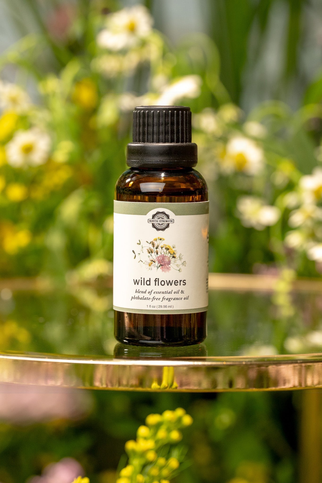 Rustic Strength wild flowers essential oil and fragrance oil blend in a clear glass bottle, showcasing a colorful floral scent.