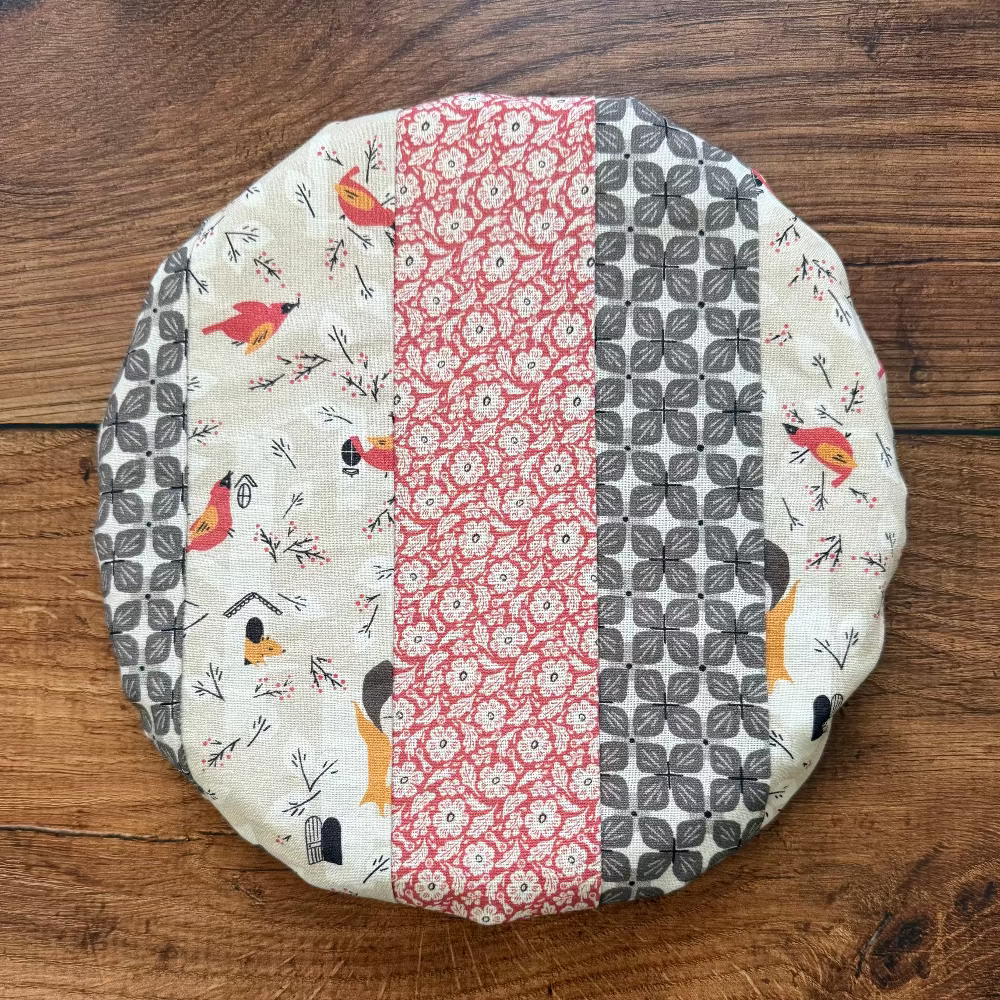 Small bowl and banneton covers from Five Oaks Farm, made for bread baking, shown on a rustic wooden surface.