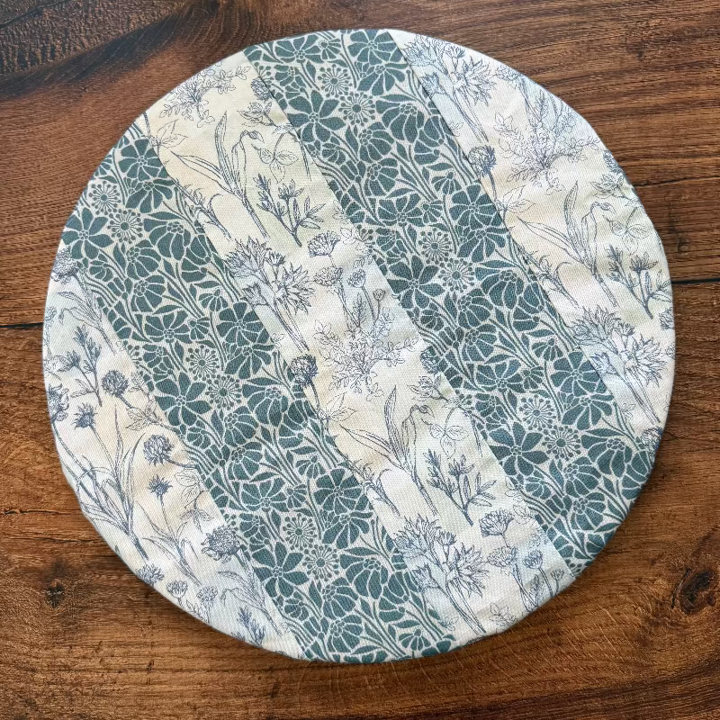Medium bowl and banneton covers from Five Oaks Farm, made for bread baking, with fabric covers and a ceramic bowl.