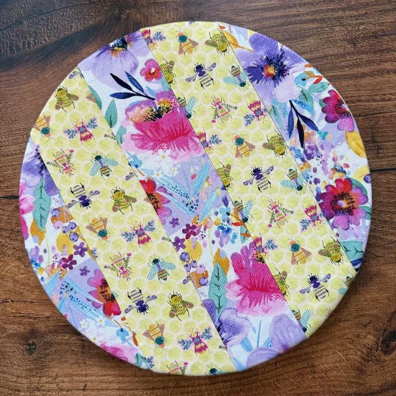 Medium bowl and banneton covers from Five Oaks Farm for bread proofing and baking, shown on a wooden surface.