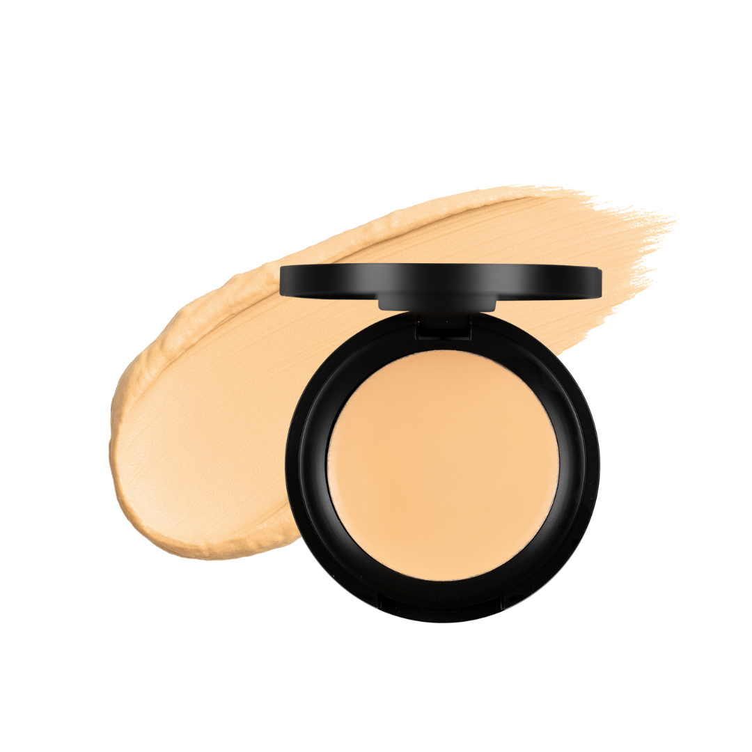 Cream concealer in a golden shade from Taylor Made Organics, lightweight and versatile for natural coverage.