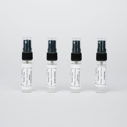 Rustic Strength’s Perfume Sample Pack | One Vial of Each Scent features four labeled vials lined up against a white background—ideal for creating your own refillable collection of unique fragrances.
