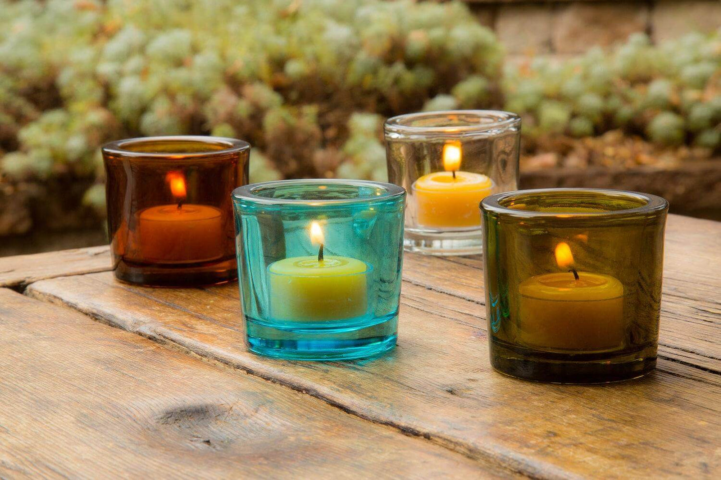 Bluecorn Candles heavy glass votive candle holders made from recycled glass, with a clear, sturdy design and smooth finish.