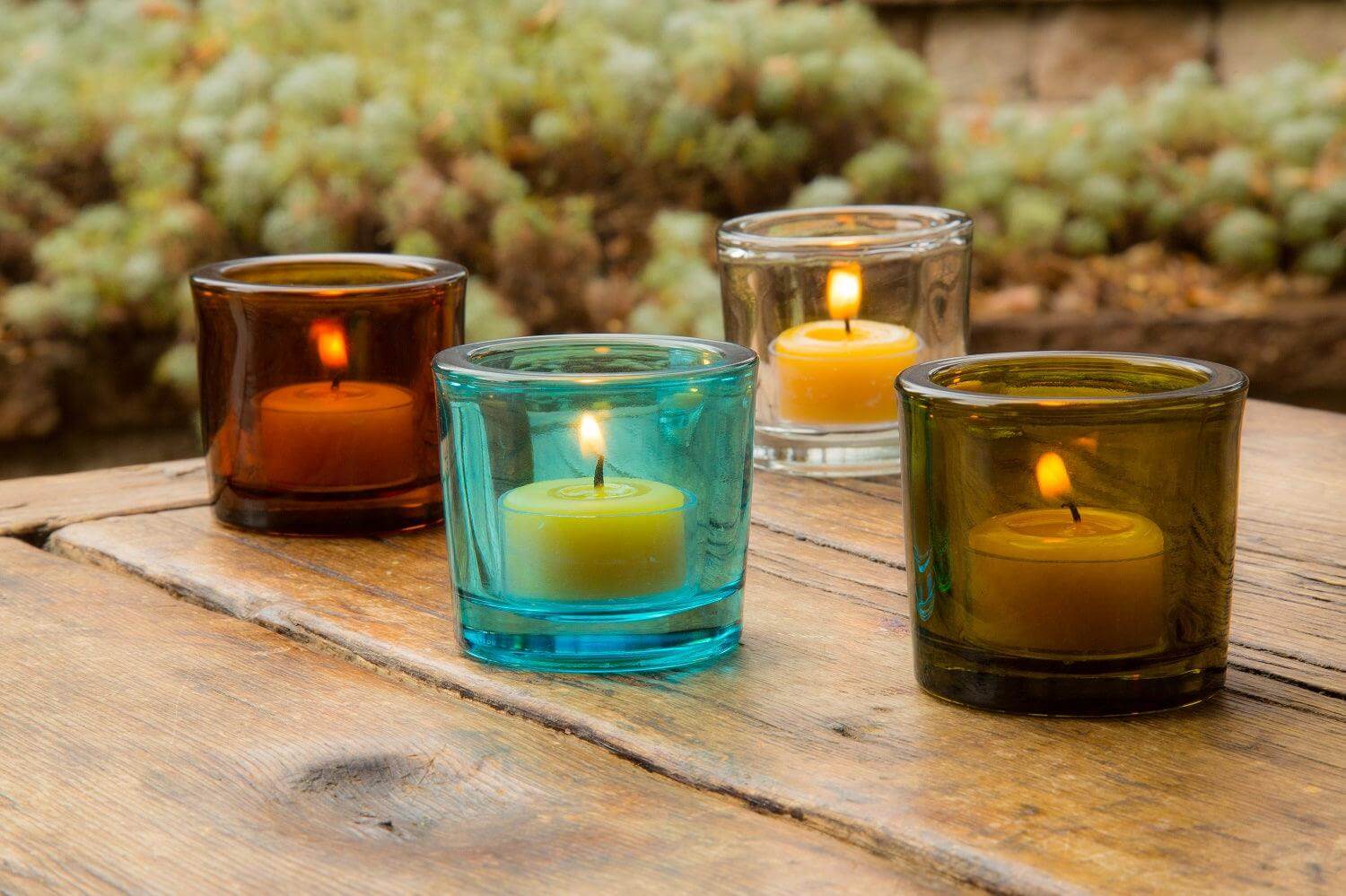 Bluecorn Candles heavy glass votive candle holders made from recycled glass, with a clear, sturdy design and smooth finish.