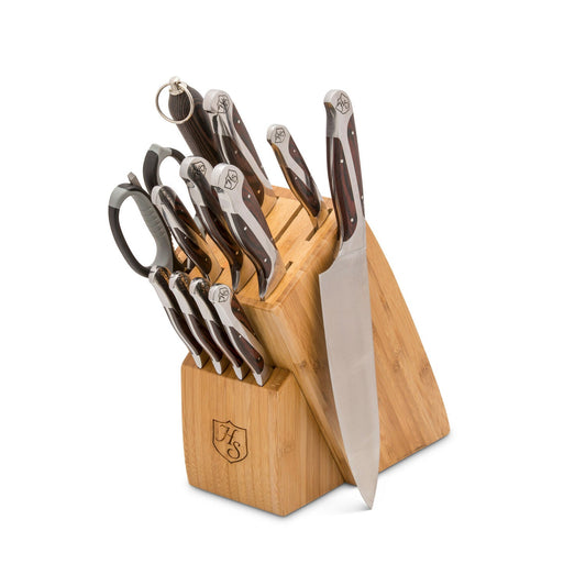 Set of Hammer Stahl Heritage Steel 12-piece cutlery including forks, knives, and spoons arranged on a wooden surface.