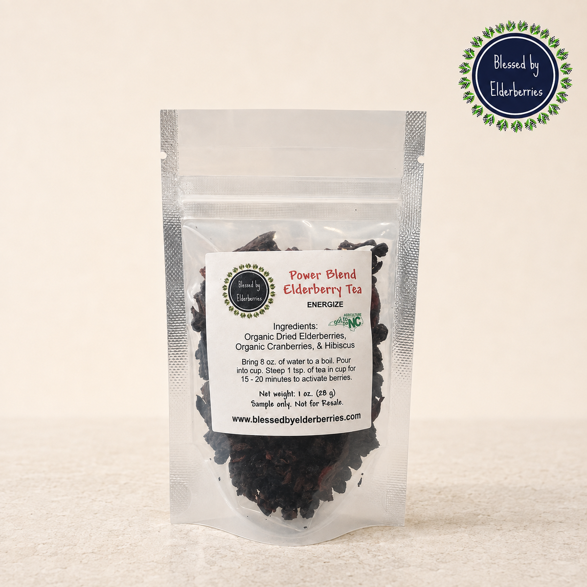 Blessed by Elderberries Power Blend Elderberry Tea in a tea infusions box with dried elderberries and herbs.