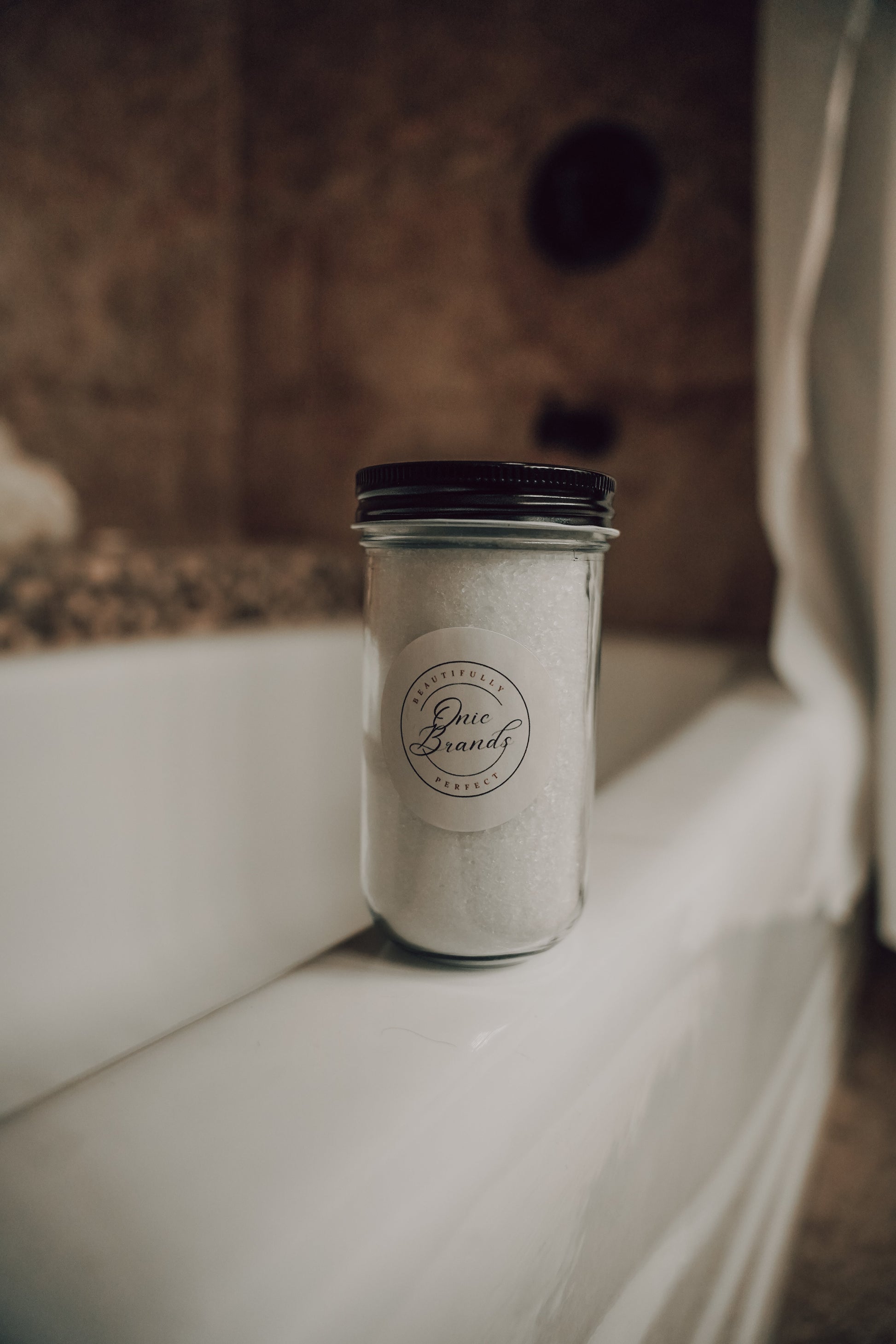 Magnesium bath and foot soak in a container, natural bath additives by Onic Brands LLC, with lavender and Epsom salts.