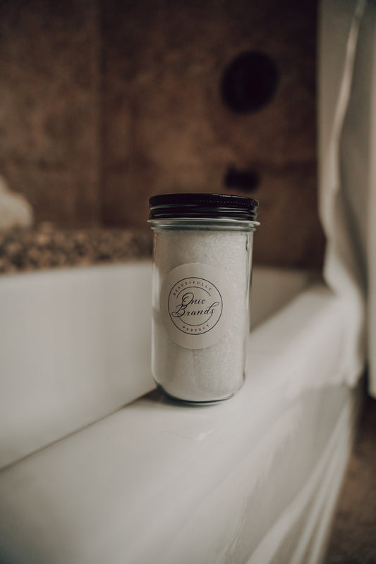 Magnesium bath and foot soak in a container, natural bath additives by Onic Brands LLC, with lavender and Epsom salts.
