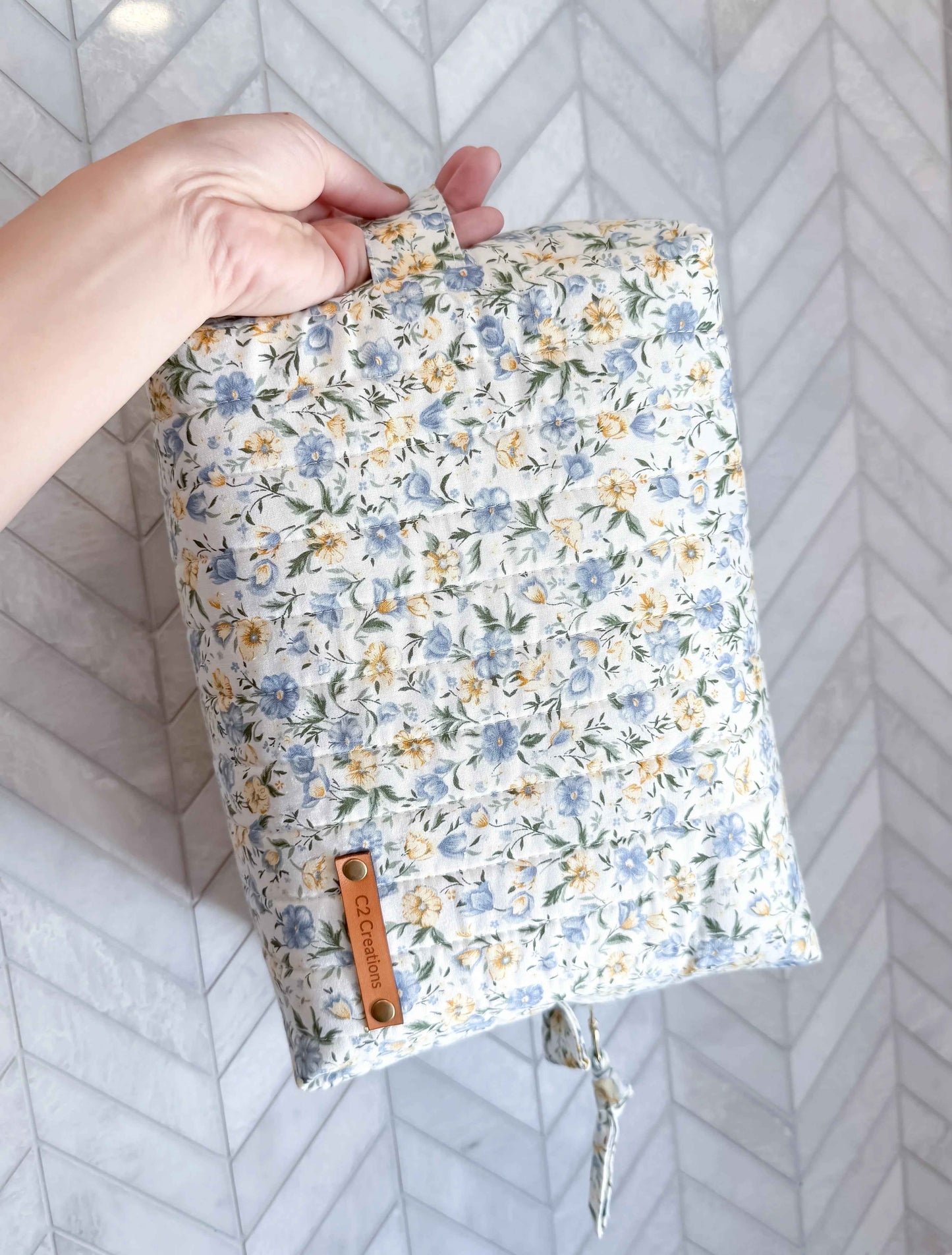 Handmade floral makeup bag with blue and yellow garden pattern, C2 Creations LLC toiletry bag on white background