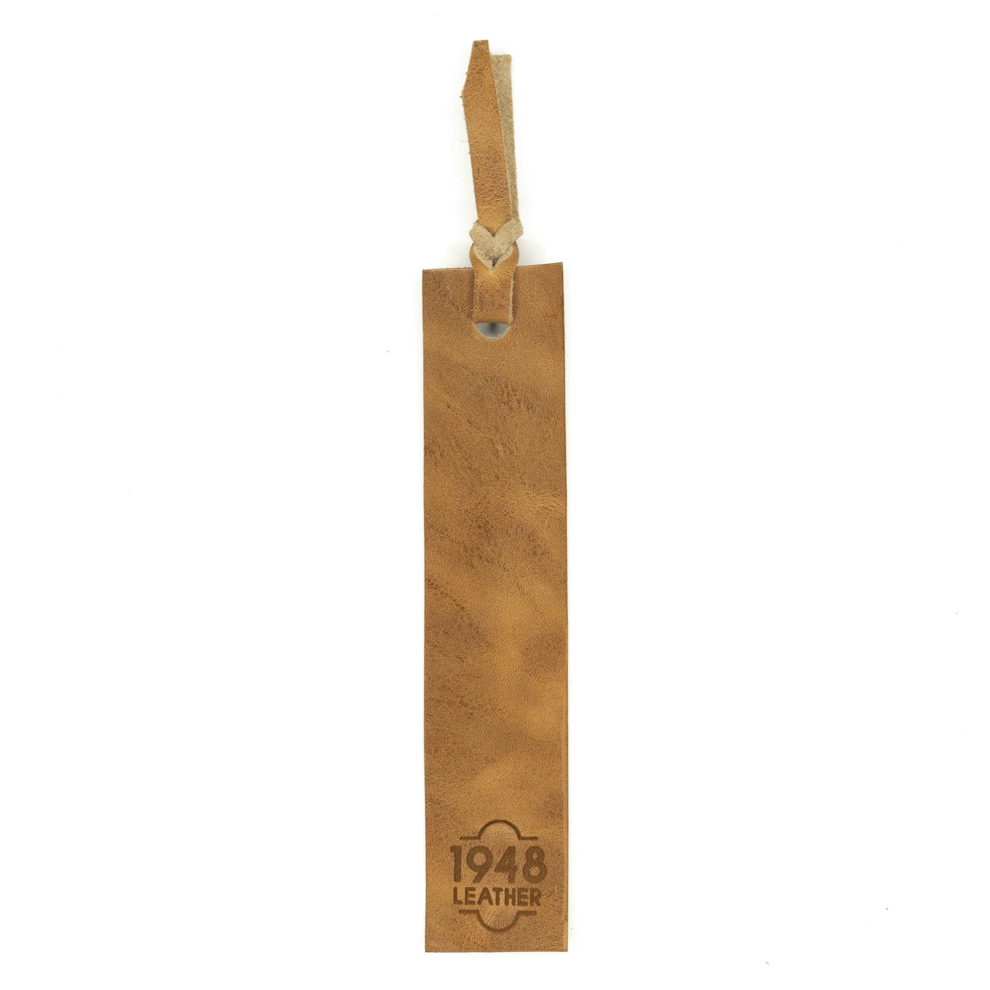 Butterscotch bookmark by Rebekah Scott Designs featuring a decorative design with a leather tassel and elegant details.