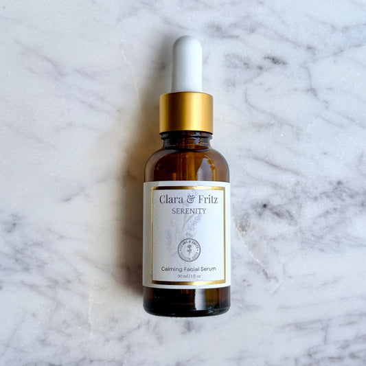 Clara & Fritz Tallow Shop Serenity Calming Facial Serum in a sleek lotion bottle, designed for soothing and moisturizing skin.