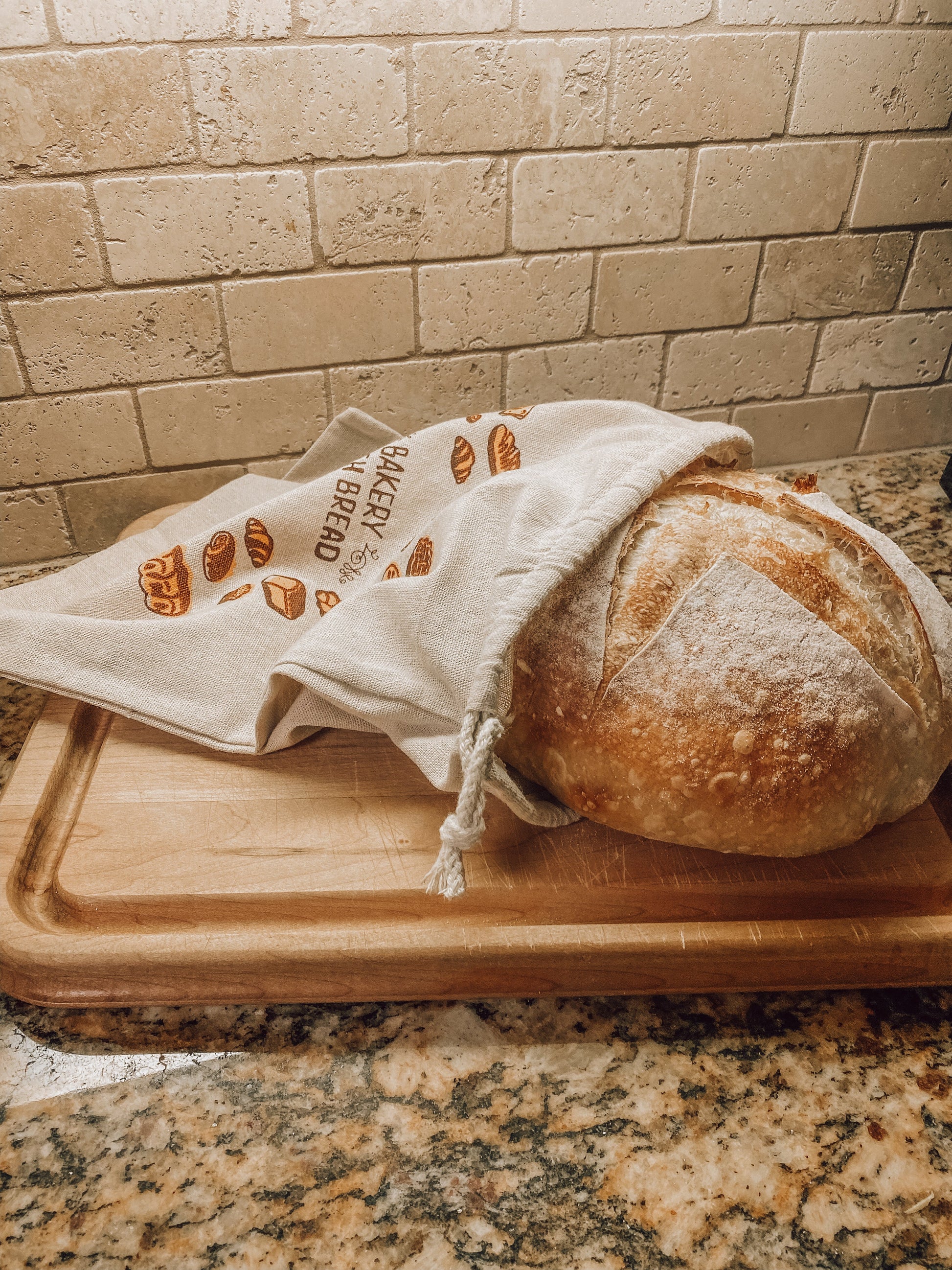 Onic Brands Bread Bag, durable fabric storage bag with Onic Brands LLC logo, designed for fresh bread storage.