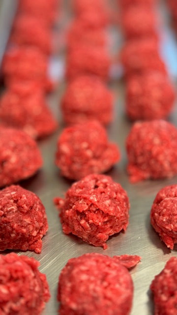 Freeze-dried sirloin meatball dog treat from Bear's Bites, showing a single juicy, textured dog treat on a neutral background.