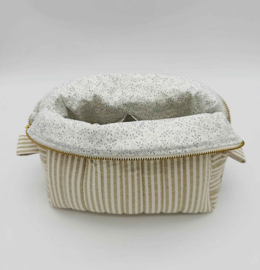 Handmade boxy makeup and toiletry bag by C2 Creations LLC in taupe and cream ticking stripe pattern, showing the stylish fabric design.