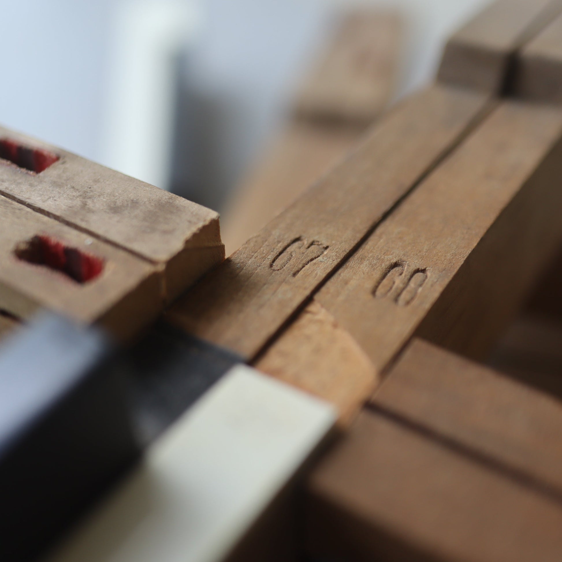 Wooden piano key cross by Dennehey Design Co. featuring detailed craftsmanship and smooth finish, ideal for spiritual decor.