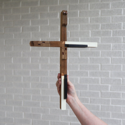 Wooden piano key cross by Dennehey Design Co. featuring detailed craftsmanship and natural wood finish.