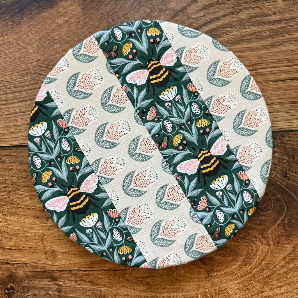 Small bowl and banneton covers from Five Oaks Farm, set for bread proofing, with fabric covers on a rustic wooden surface.