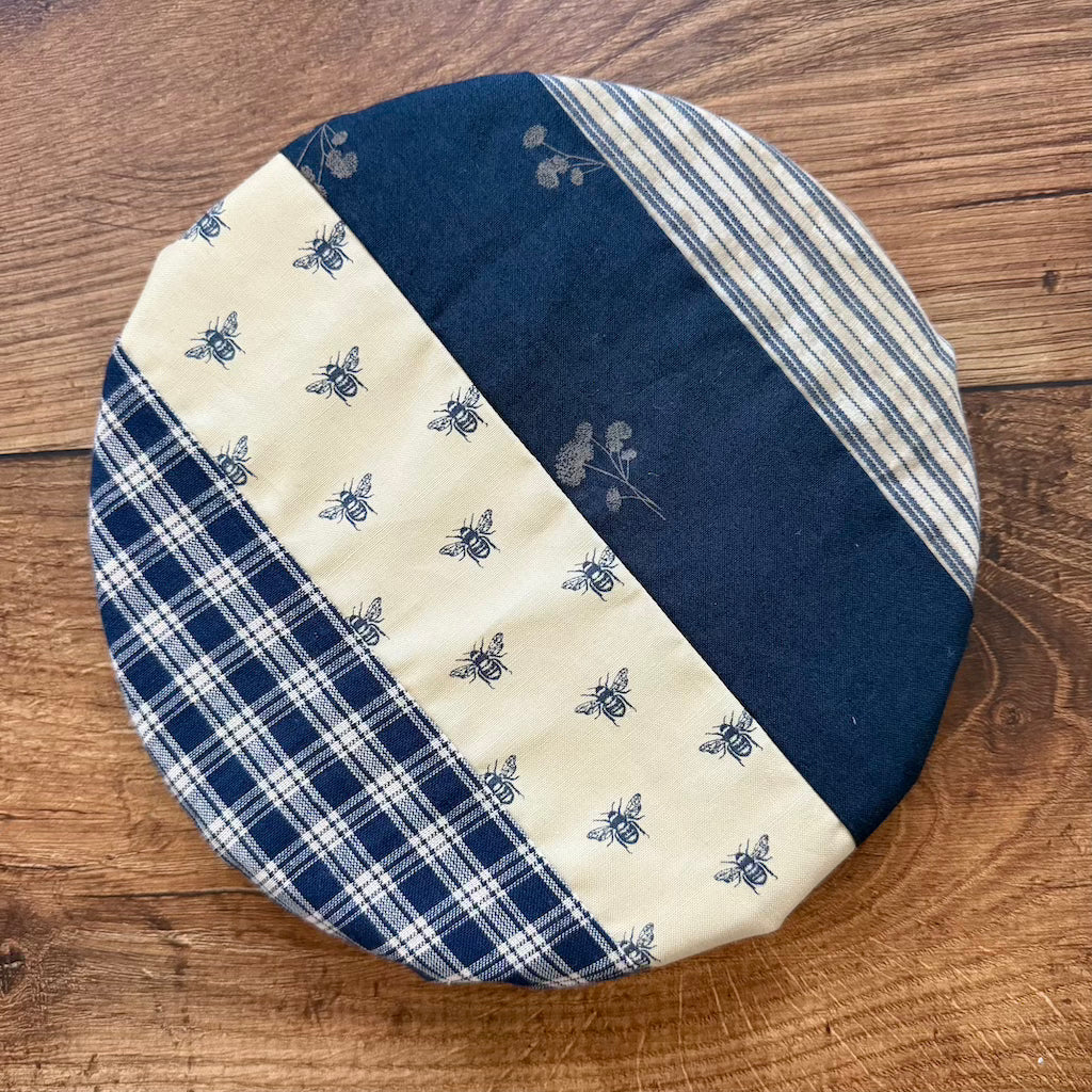 Small bowl and banneton covers from Five Oaks Farm, used for proofing and baking bread in rustic kitchen settings.