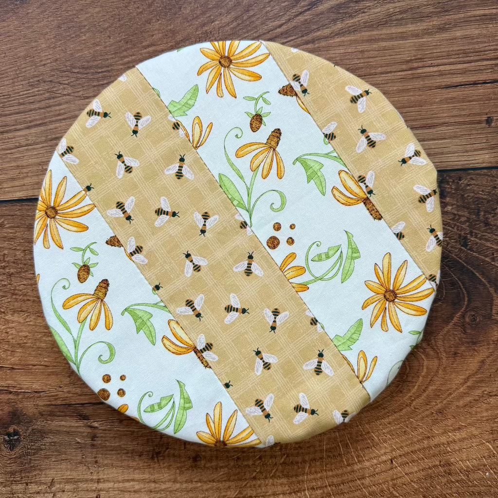 Small bowl and banneton covers from Five Oaks Farm, used for bread baking and dough proofing, on a rustic wooden surface.