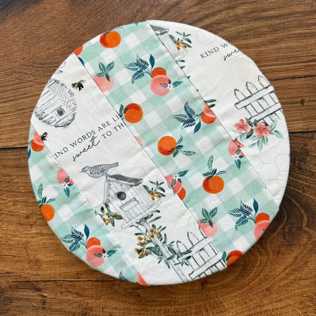 Small bowl and banneton covers from Five Oaks Farm, displayed on a wooden surface with rustic kitchen background.