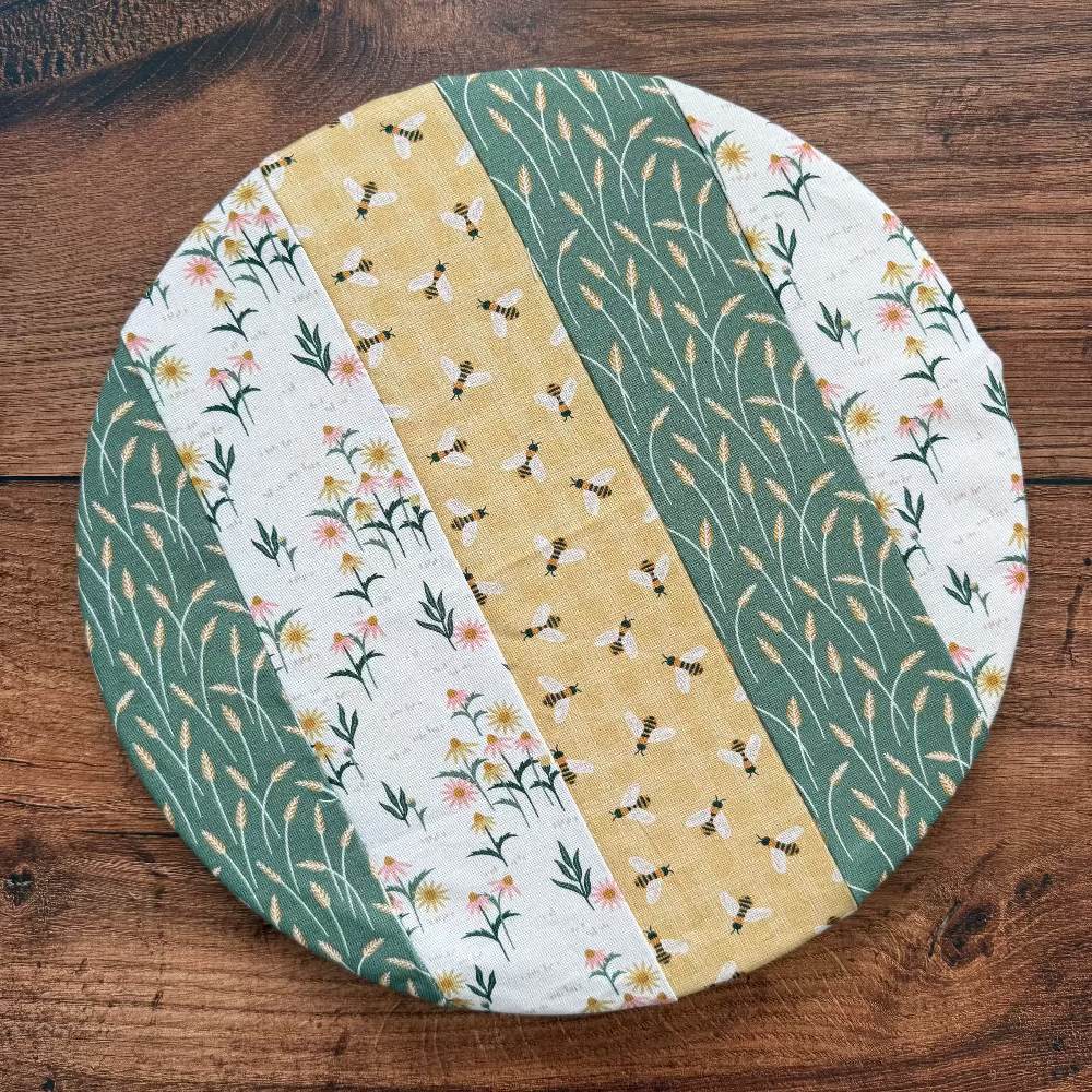 Medium bowl and banneton covers from Five Oaks Farm, rustic kitchen accessories for bread baking, shown on a wooden surface.