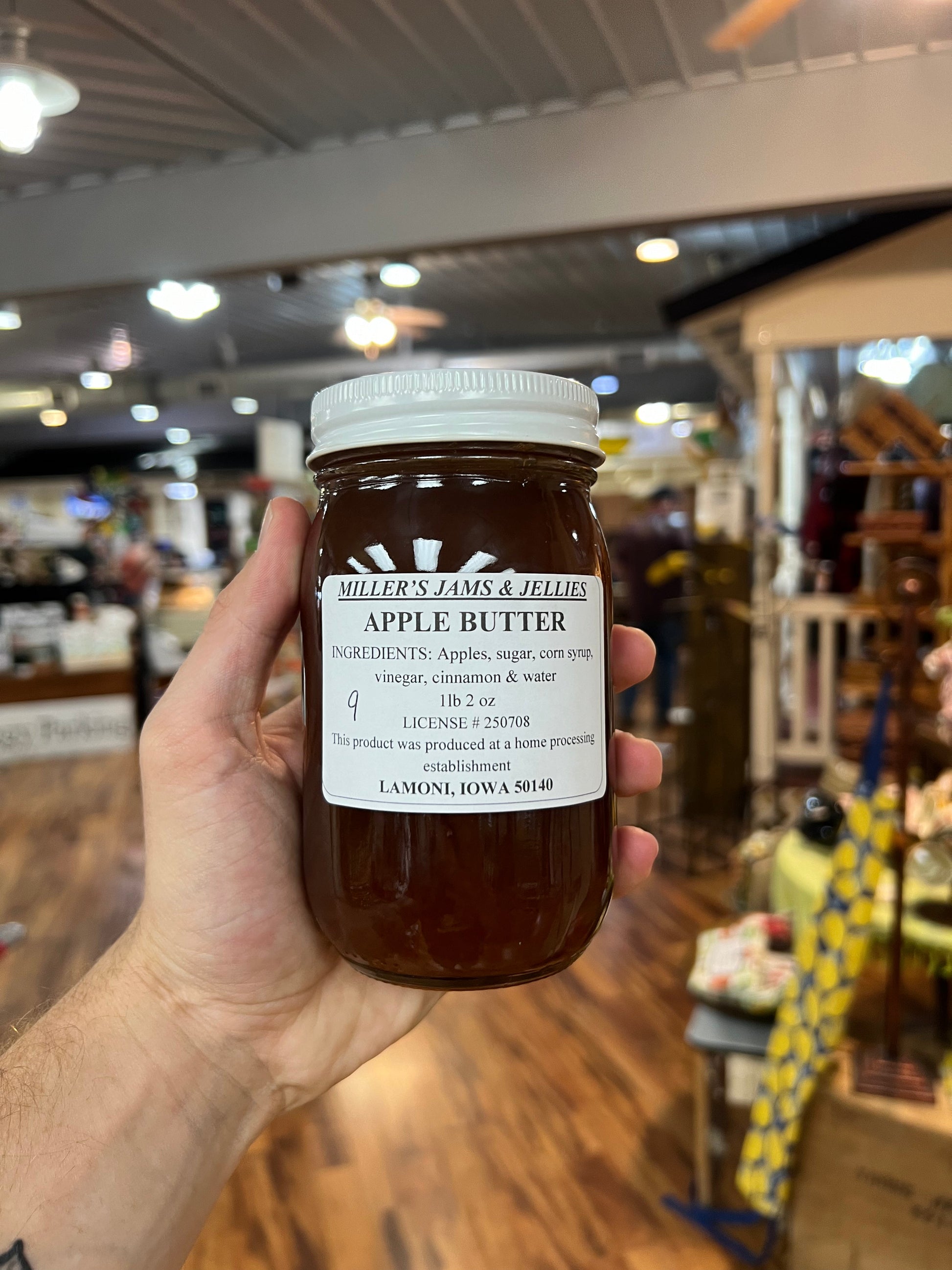 Amish Country Store Amish apple butter jam jar with label, showcasing smooth, rich apple spread made locally in Amish tradition.