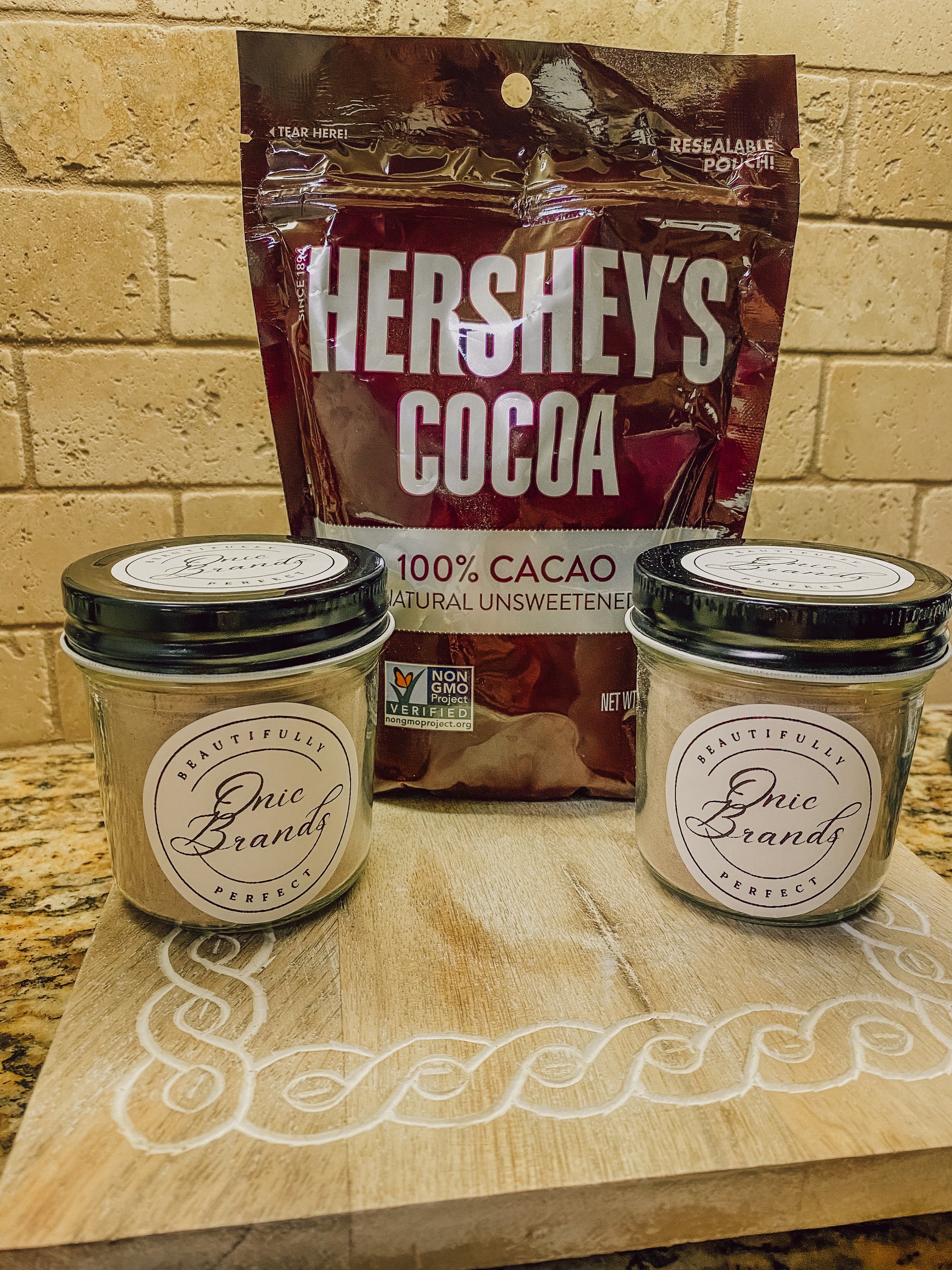 Onic Brands Hot Cocoa Mix in a jar, showing the creamy cocoa powder with label, perfect for making warm chocolate drinks.