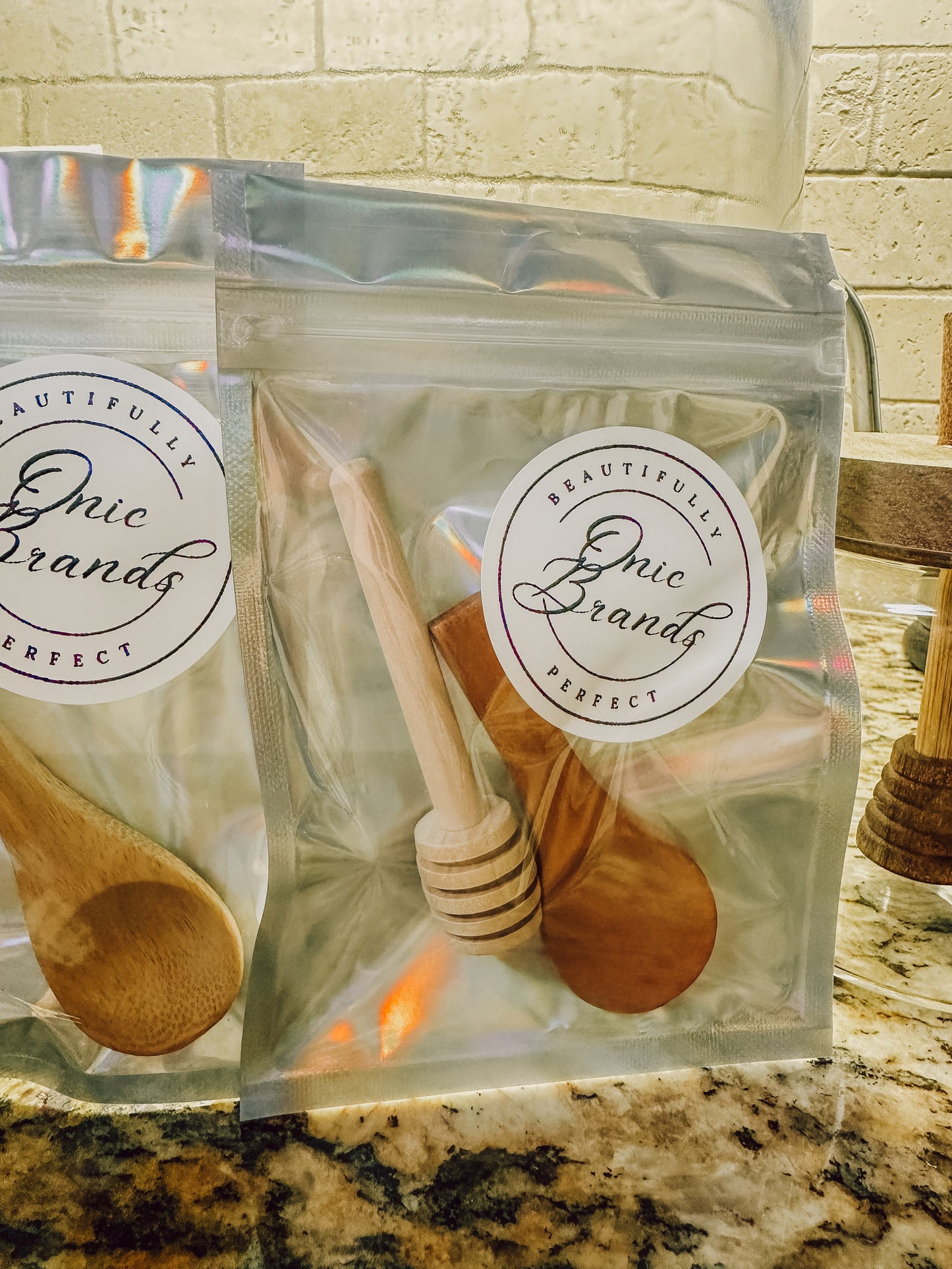 Two jars of Onic Brands LLC Honey Duo with golden honey, labeled and displayed on a clean surface.