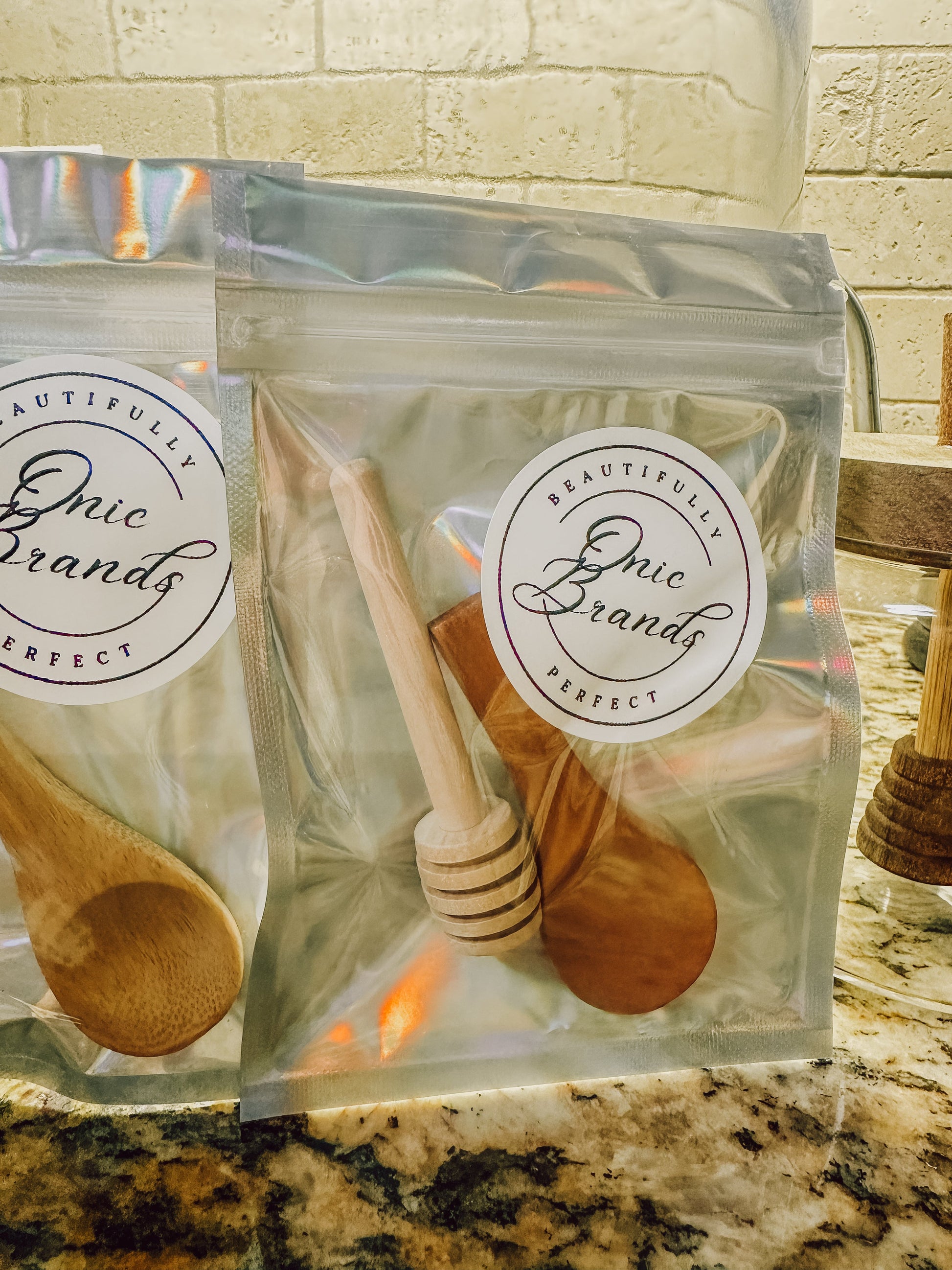 Two jars of Onic Brands LLC Honey Duo with golden honey, labeled and displayed on a clean surface.