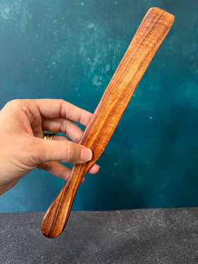 Five Oaks Farm Spurtle, handmade wooden cooking utensil from the farm, shown in close-up with natural wood grain details.