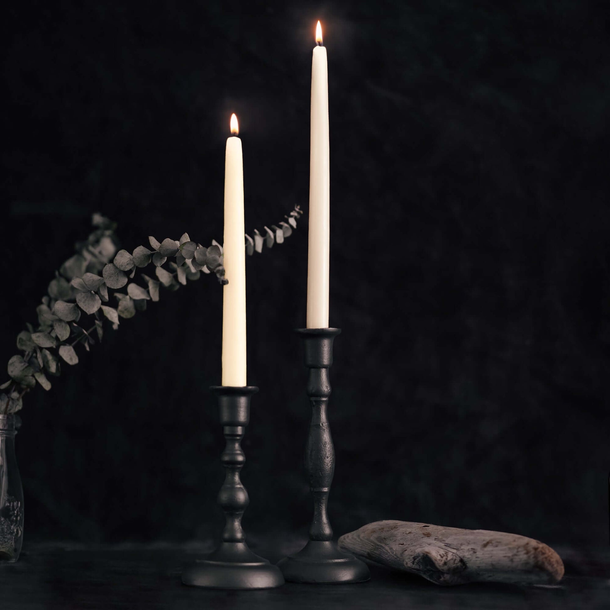 Set of four hand-dipped ivory beeswax taper candles from Bluecorn Candles with gray candlesticks, in a bulk 4-pair bundle.