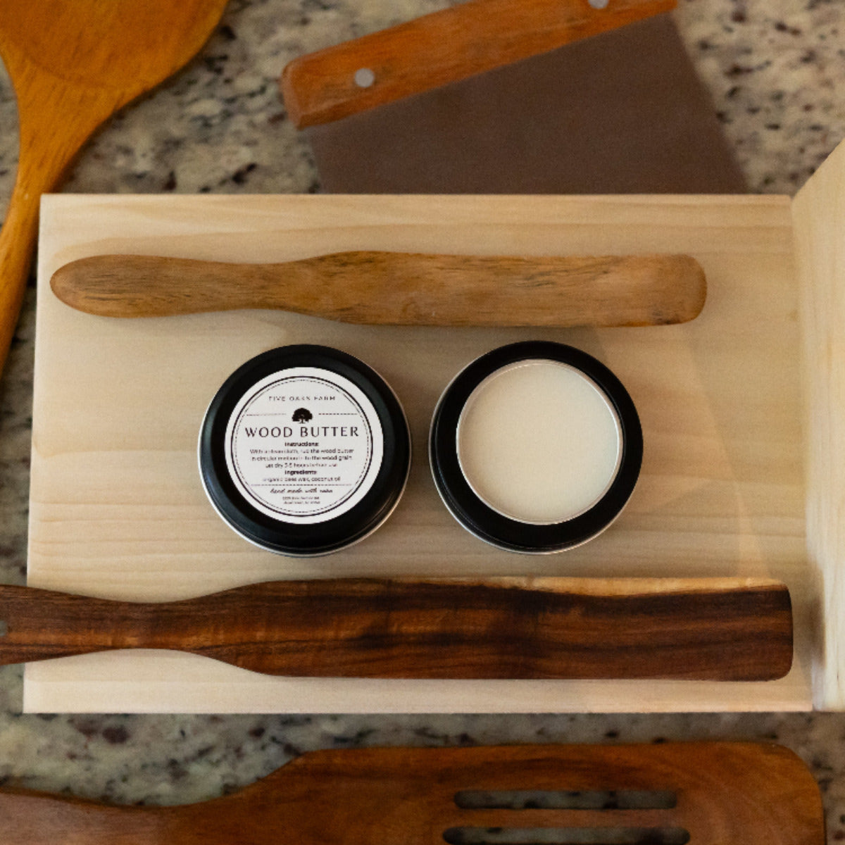 Jar of Five Oaks Farm Wood Butter from the Farm, showing smooth, creamy wood treatment product in a rustic jar.