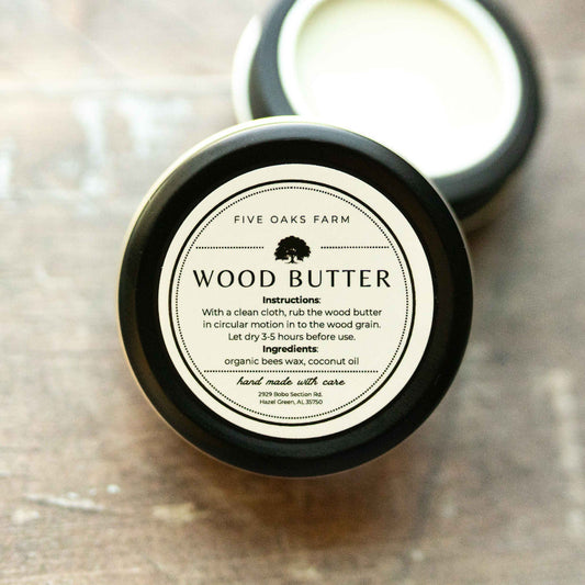 Natural wood butter from Five Oaks Farm, showing a jar of nourishing wood conditioner with a rustic label on a wooden surface.