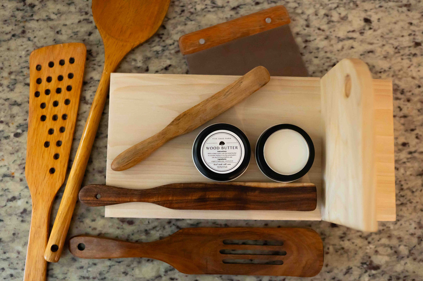 Natural wood butter from Five Oaks Farm, showcasing a jar of nourishing wood treatment with a rustic label and wooden accents.