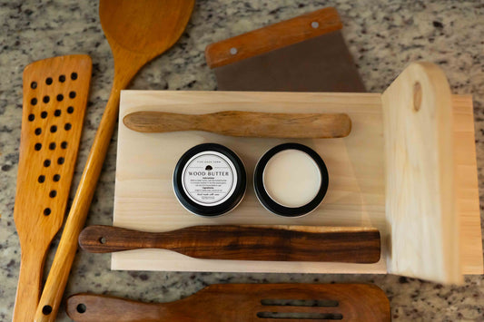 Five Oaks Farm wood butter jar with rustic label and wooden lid, used for nourishing and protecting wooden surfaces.