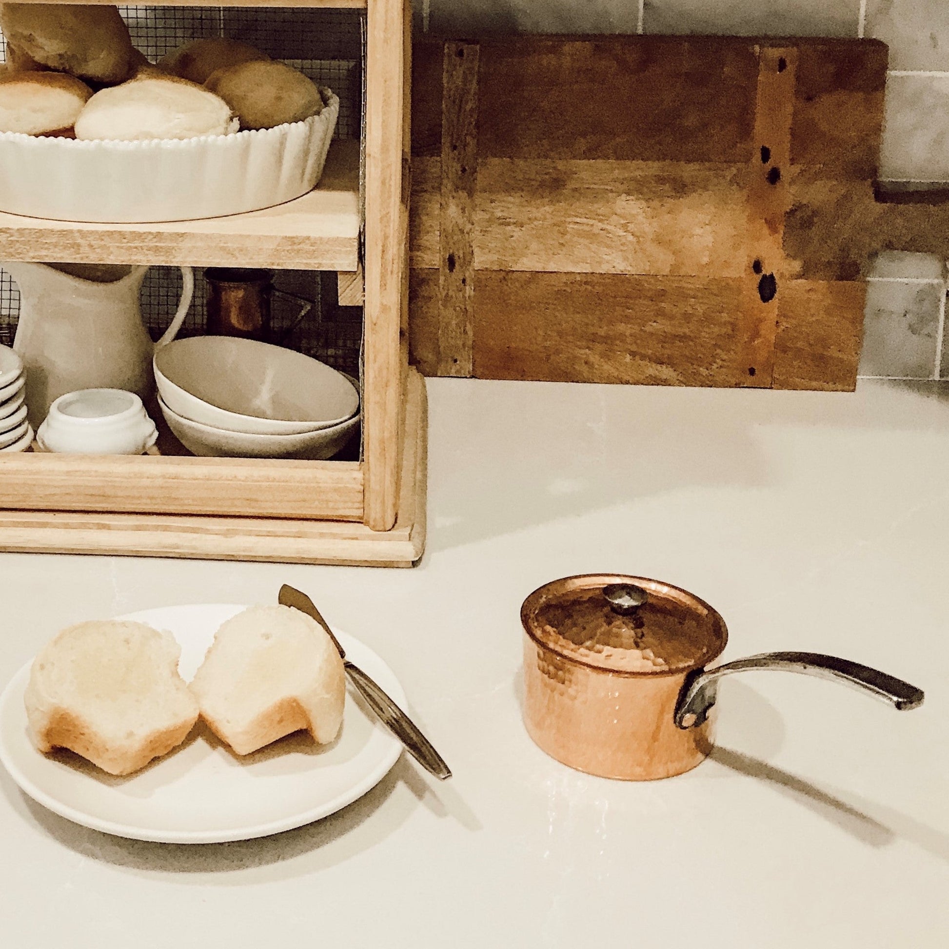 Petite French copper butter pot with lid from Sertodo, showing a shiny copper pot with a lid and handle, ideal for kitchen use.