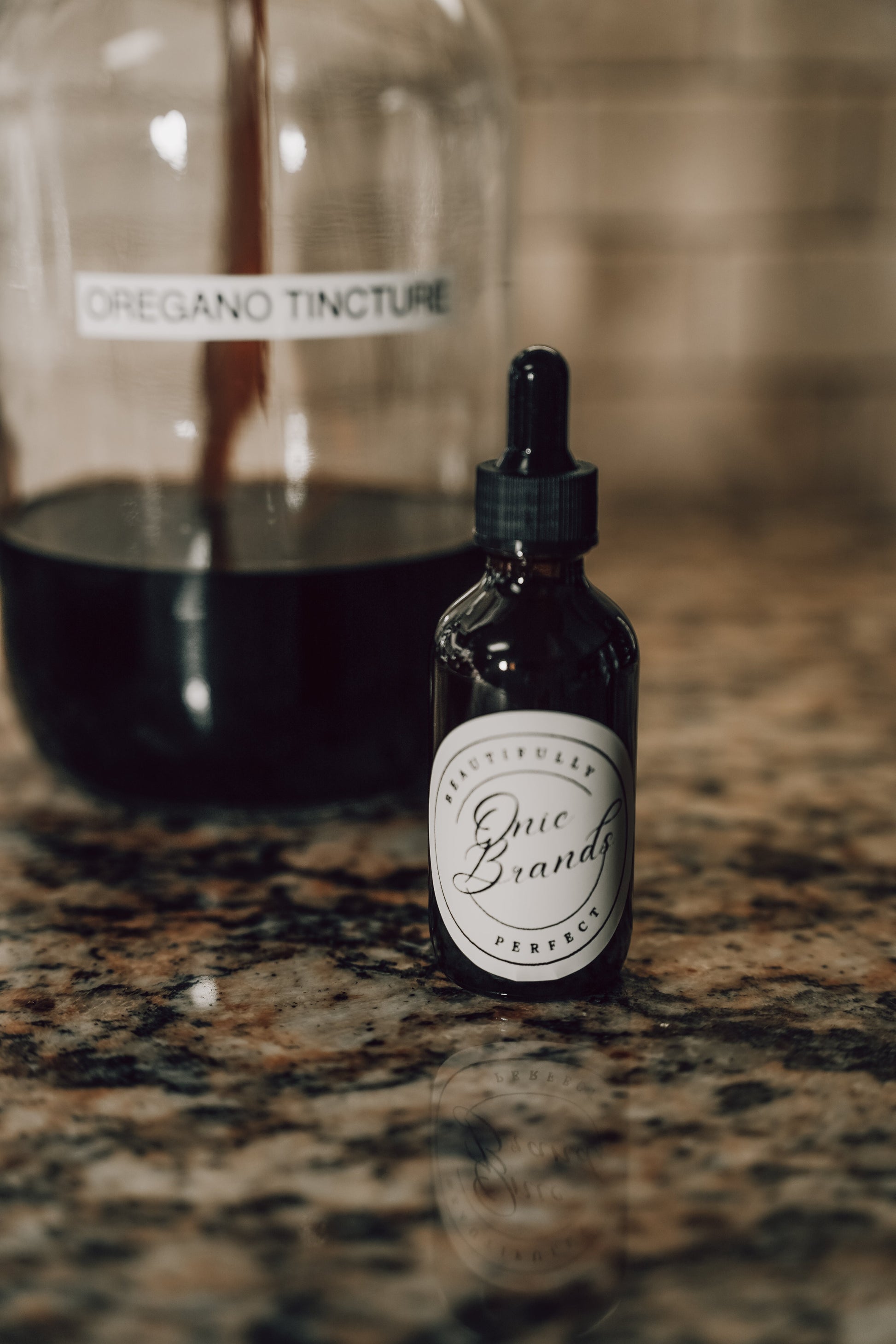 Onic Brands Elemental Oregano tincture bottle with dropper, herbal supplement for wellness and natural health support.