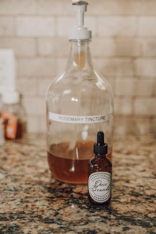 Bottle of Onic Brands Elemental Rosemary Tincture with label, placed on a white background.