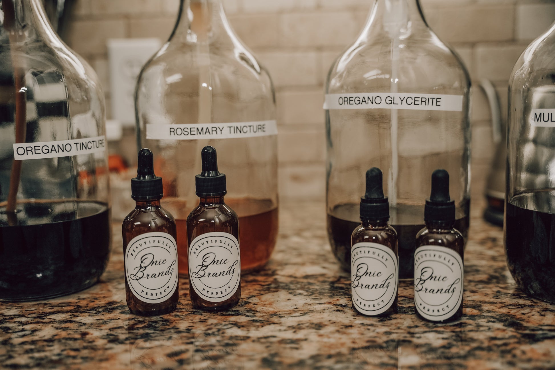 Onic Brands Elemental Oregano tincture bottle with dropper cap, label showing product details and branding.