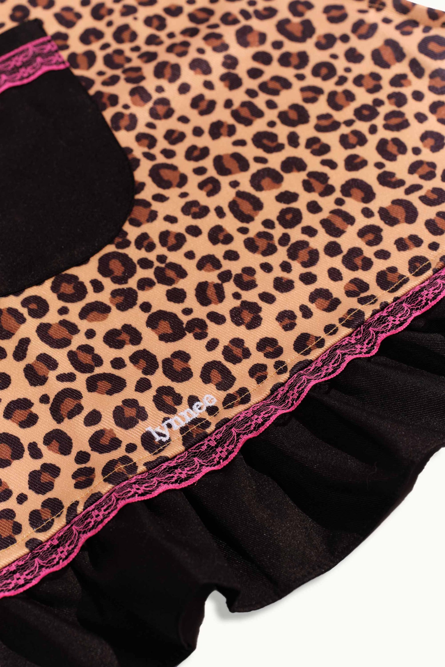 Pink leopard apron by Lynnee featuring a stylish animal print, perfect for cooking or baking in the kitchen.