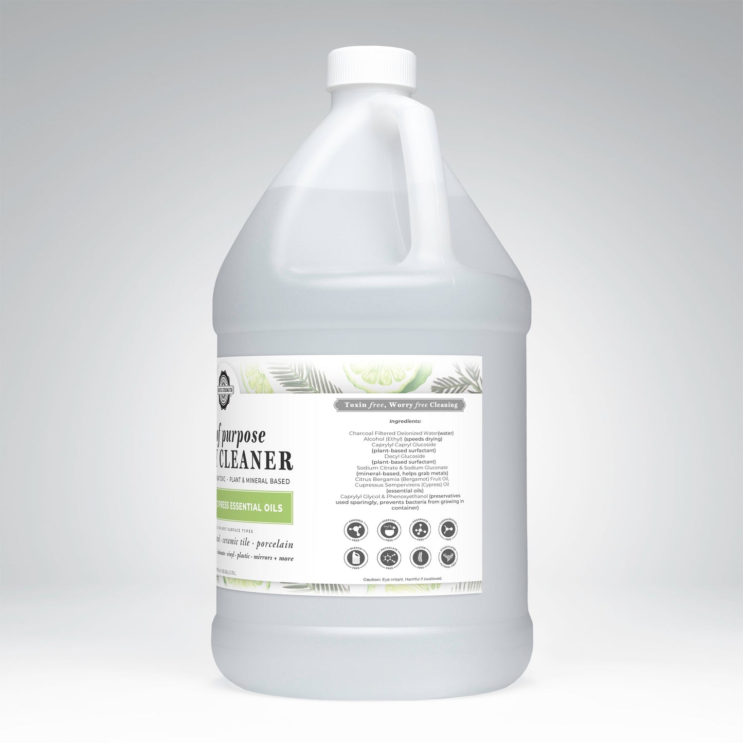 A white plastic gallon jug of Rustic Strength Lots of Purpose Spray Cleaner | Bergamot & Cypress, plant-based and toxin-free, with a gray cap and green-white label showing ingredients and natural, non-toxic icons on a light gray background.