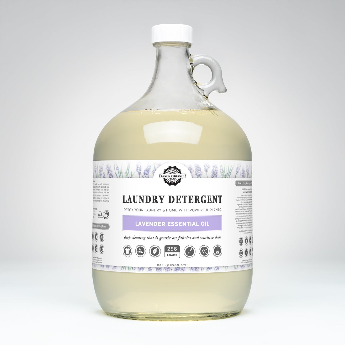 Rustic Strength Laundry Detergent | Lavender comes in a clear gallon jug with handle, white cap, white label featuring lavender illustrations and Lavender Essential Oil text. Contains light yellow hypoallergenic, biodegradable detergent.