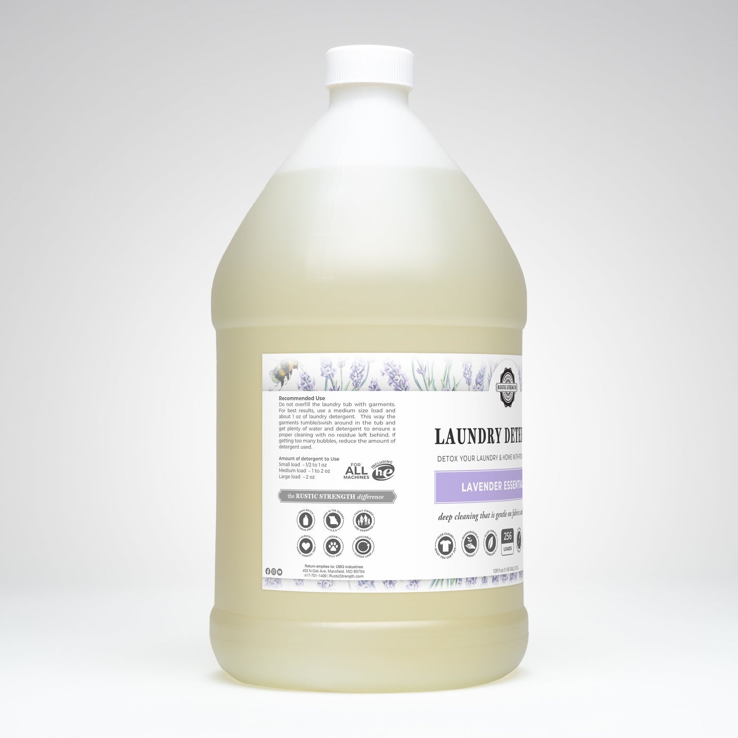 A gallon-sized bottle of Rustic Strength Laundry Detergent | Lavender features a white cap, clear liquid, and a label with lavender illustrations and product info. The background is plain white.