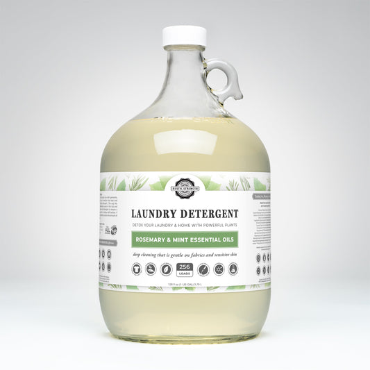 Rustic Strength rosemary and mint laundry detergent gallon with natural plant-based formula and fresh herbal scent.