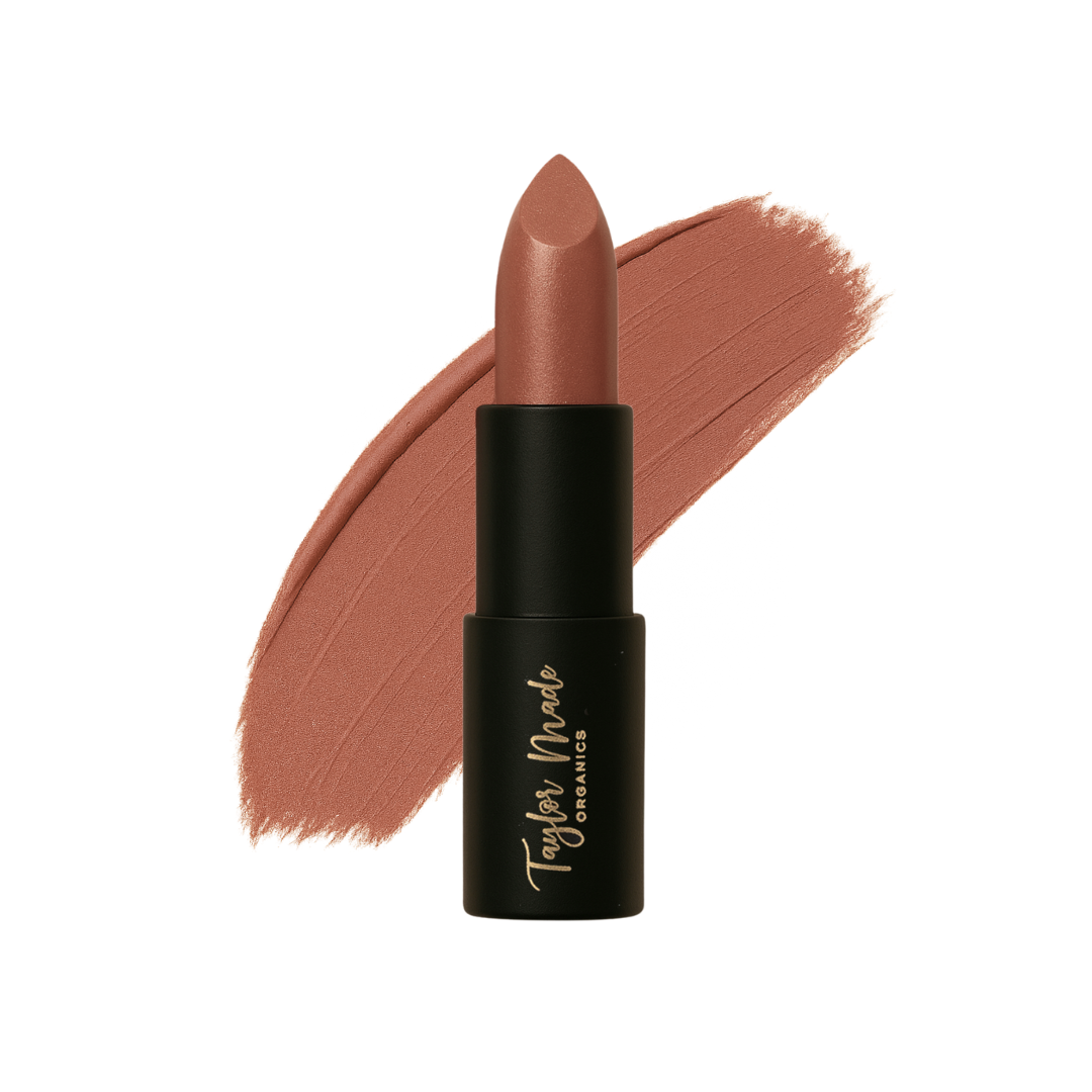 Organic Taylor Made Organics lipstick in a sleek tube, featuring a vibrant lipstick shade ready for application.