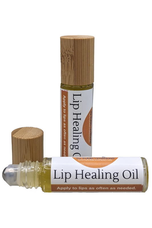 By Robin Creations lip repair healing oil in a small glass bottle with a dropper for soothing, nourishing lip care.